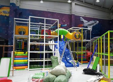Commercial indoor playground equipment during installation
