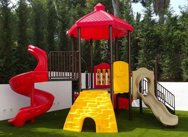 Play structure in residential garden, Spain
